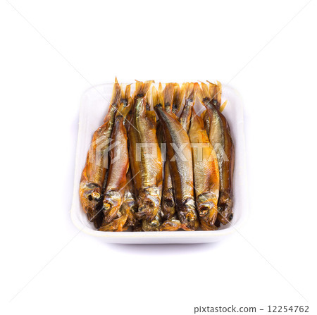 Smoke-dried anchovies in plate close up. 12254762
