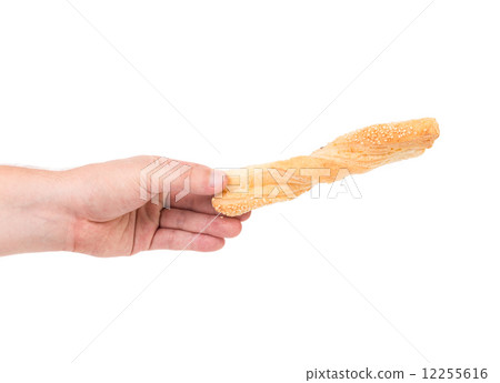 Bread with sesame in hand on white. 12255616