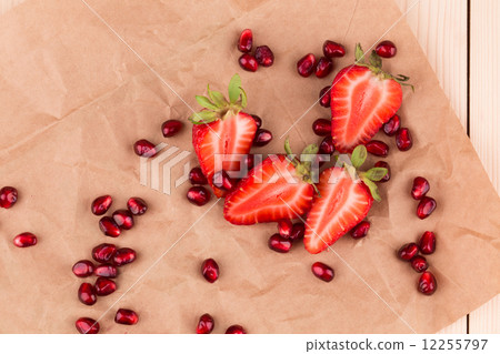 Half of strawberry and pomegranate seeds. Half of strawberry and pomegranate seeds. 12255797