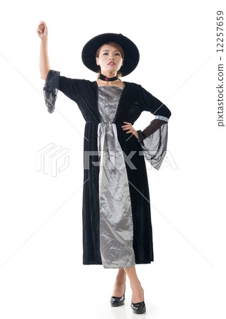Asian witch hold something 12257659