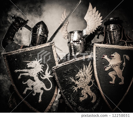 Three medieval knights in a smoke 12258031