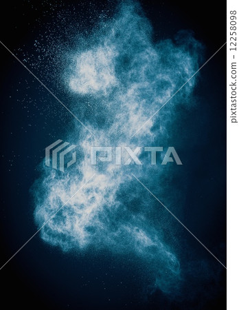 Blue powder exploding isolated on black Blue powder exploding isolated on black 12258098