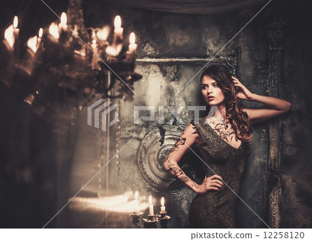 Tattooed beautiful woman in old spooky interior Tattooed beautiful woman in old spooky interior 12258120