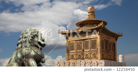 Bronze Guardian Lion Statue and bronze pagoda in the Forbidden City, Beijing, China Bronze Guardian Lion Statue and bronze pagoda in the Forbidden City, Beijing, China 12258450
