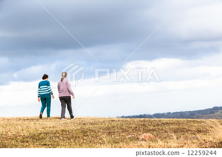 Women Mother Daughter Walking Outdoors Women Mother Daughter Walking Outdoors 12259244