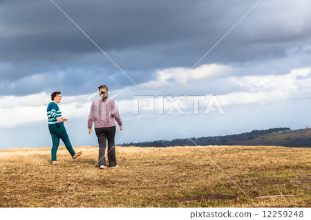 Women Mother Daughter Walking Outdoors Women Mother Daughter Walking Outdoors 12259248