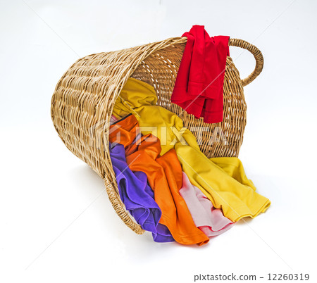 Clothes in wooden laundry basket Clothes in wooden laundry basket 12260319