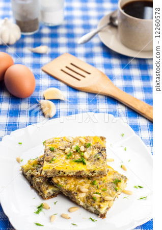 Delicious omlette with sardines and pine seeds 12260578