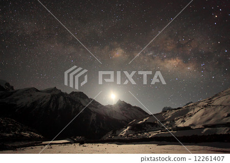 Night sky and stars passing by behind mountain Taboche, Cholatse 12261407