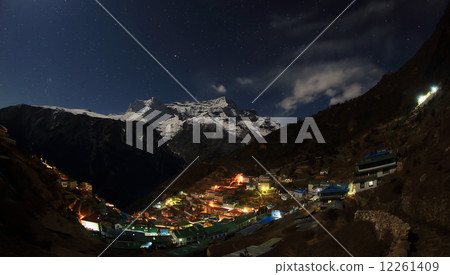 Night sky and stars passing by behind mountain Kongde Ri, Namche 12261409