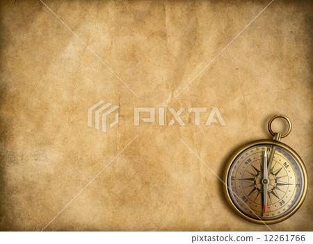 old brass or golden compass with vintage map background old brass or golden compass with vintage map background 12261766