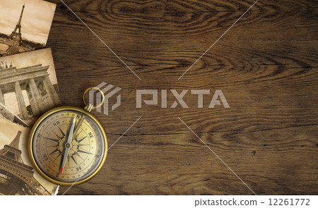 Adventure concept, old pictures and compass on wooden table Adventure concept, old pictures and compass on wooden table 12261772