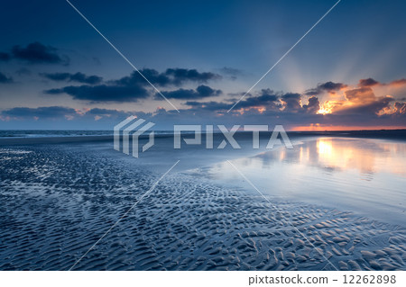 sunrise over North sea coast at low tide sunrise over North sea coast at low tide 12262898