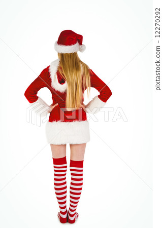 Festive blonde standing rear view Festive blonde standing rear view 12270292