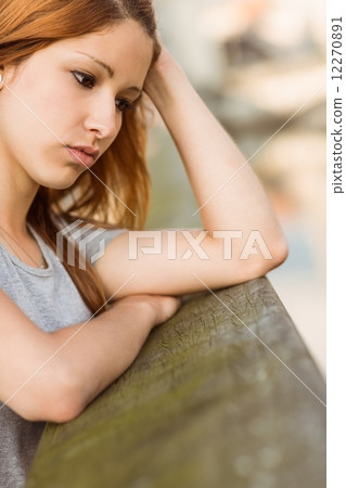 Sad redhead thinking about her life 12270891