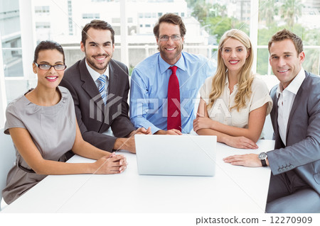 Business people using laptop in office Business people using laptop in office 12270909