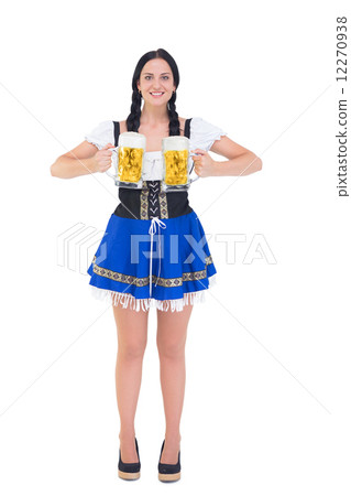 Pretty oktoberfest girl holding beer tankards 12270938