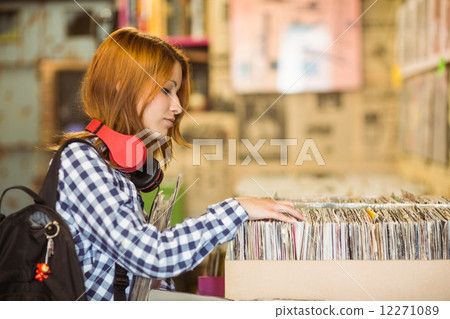 Pretty redhead searching a vinyl 12271089