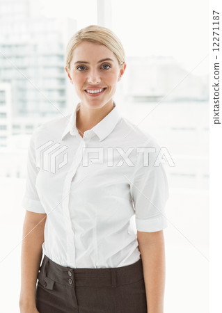 Beautiful young businesswoman in office Beautiful young businesswoman in office 12271187