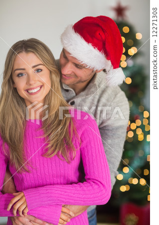 Smiling man wearing santa hat Smiling man wearing santa hat 12271308