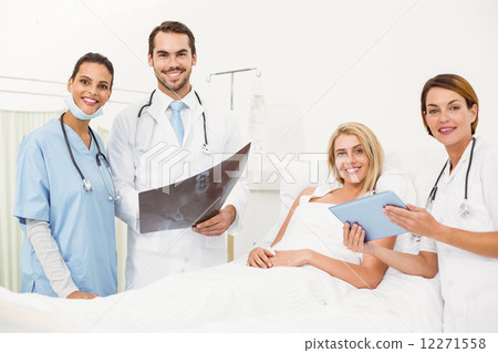 Portrait of doctors and patient with x-ray 12271558