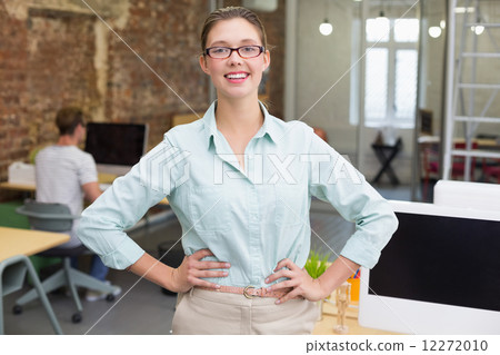 Smiling female photo editor in office 12272010