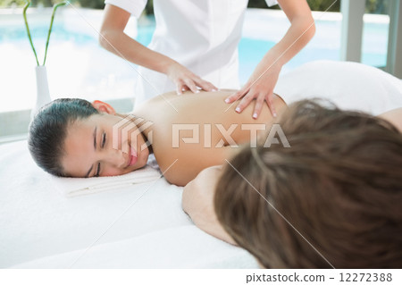 Couple enjoying massage at health farm 12272388