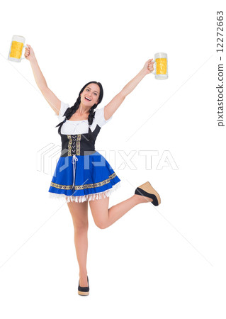 Pretty oktoberfest girl holding beer tankards Pretty oktoberfest girl holding beer tankards 12272663