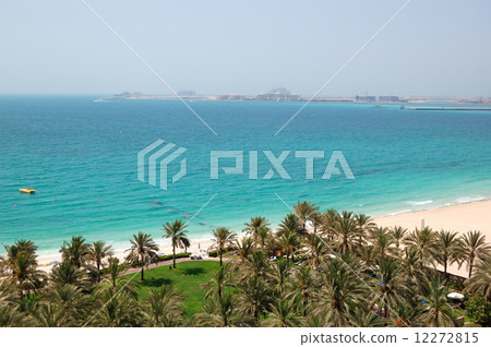 Beach with a view on Jumeirah Palm man-made island, Dubai, UAE Beach with a view on Jumeirah Palm man-made island, Dubai, UAE 12272815