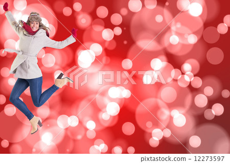 Composite image of happy blonde in winter clothes posing 12273597