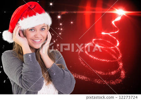 Composite image of festive blonde smiling at camera 12273724