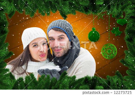 Composite image of young winter couple 12273725