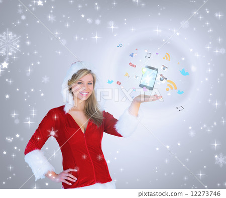 Composite image of pretty girl presenting in santa outfit 12273746