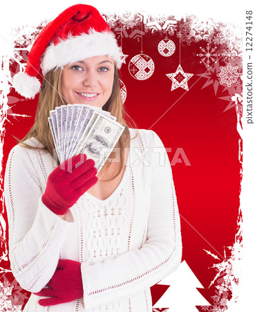 Composite image of festive blonde showing fan of dollars Composite image of festive blonde showing fan of dollars 12274148
