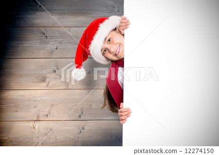 Composite image of festive little girl showing card 12274150