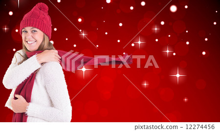 Composite image of happy blonde in winter clothes 12274456