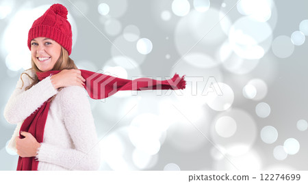 Composite image of happy blonde in winter clothes 12274699