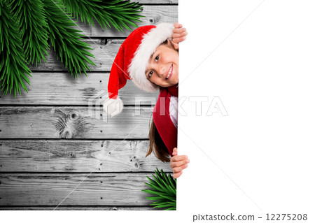 Composite image of festive little girl showing card 12275208