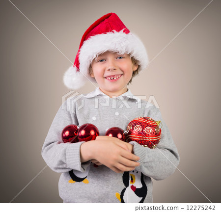 Composite image of festive boy smiling Composite image of festive boy smiling 12275242