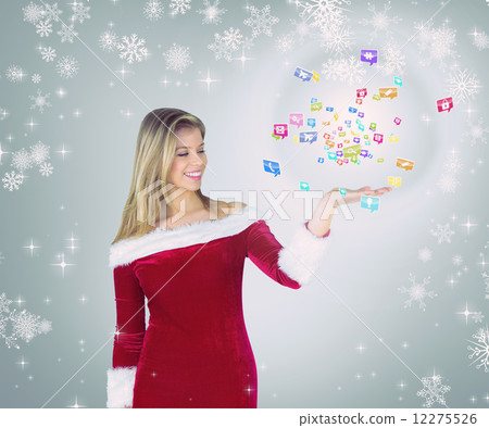 Composite image of pretty girl presenting in santa outfit 12275526