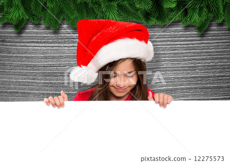Composite image of festive little girl showing card 12275573
