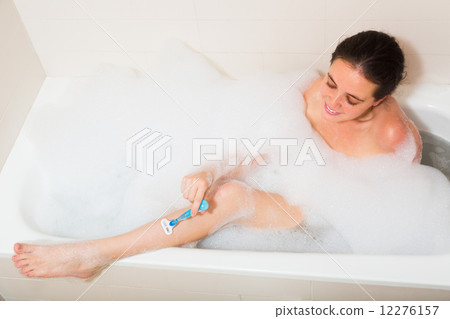 Girl in foam at bathtub 12276157