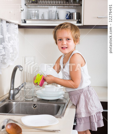 Baby girl washing dishes 12276491