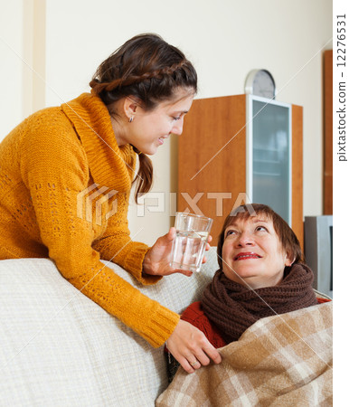 daughter caring for unwell mother 12276531