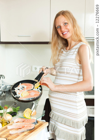 Smiling pregnant woman with salmon Smiling pregnant woman with salmon 12276669