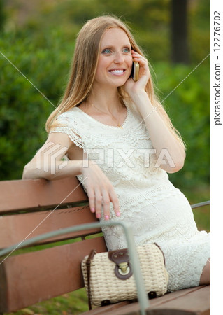 Happy woman talking by phone Happy woman talking by phone 12276702