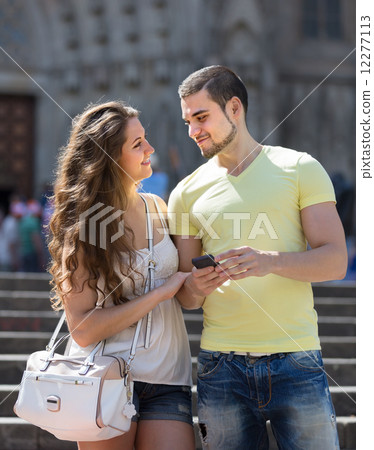 Couple using the map at smartphone 12277113