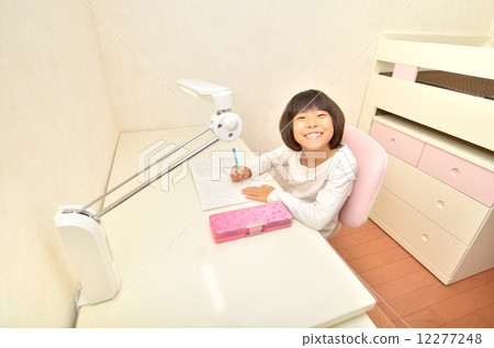 Elementary school girl studying in a children's room 12277248