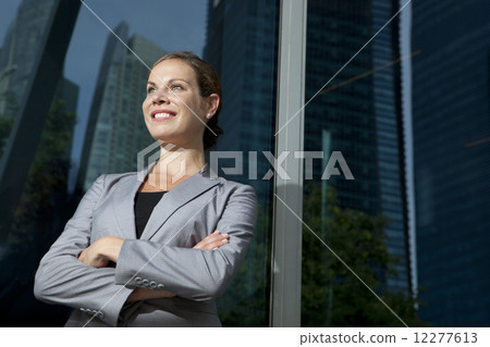 Businesswoman arms crossed outdoors 12277613