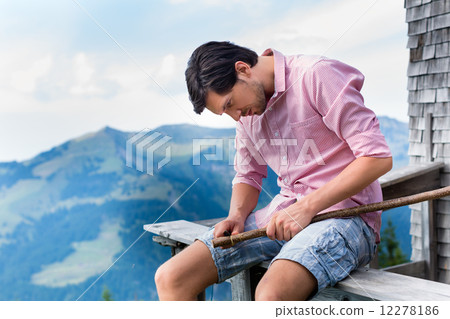 Alps - Man on mountains sitting at cabin in tirol Alps - Man on mountains sitting at cabin in tirol 12278186